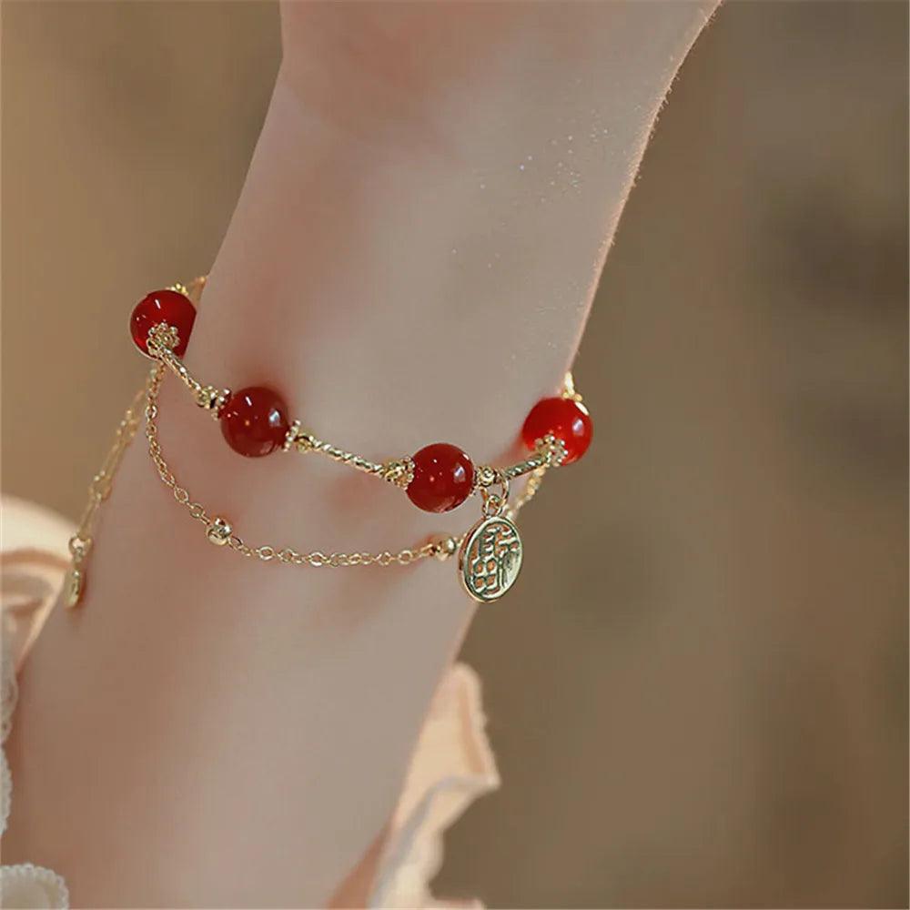 Bracciale "Cascata Cremisi" in Agata Rossa e Oro a Strati