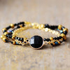 Bracciale "Aura Benefica" con Perline Dorate in Onice Nera